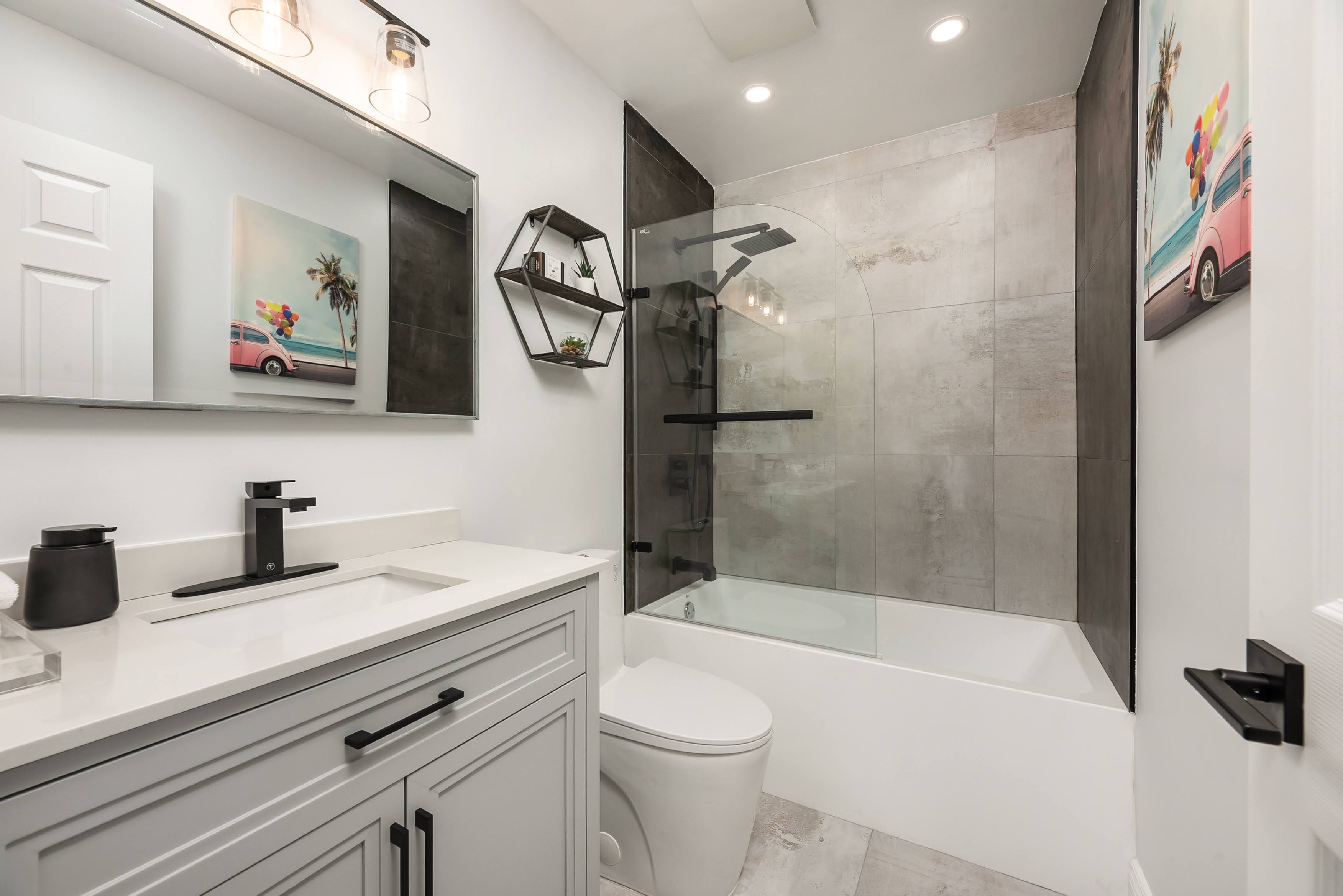 Modern bathroom renovation with grey ceramic tiles in Dorval
